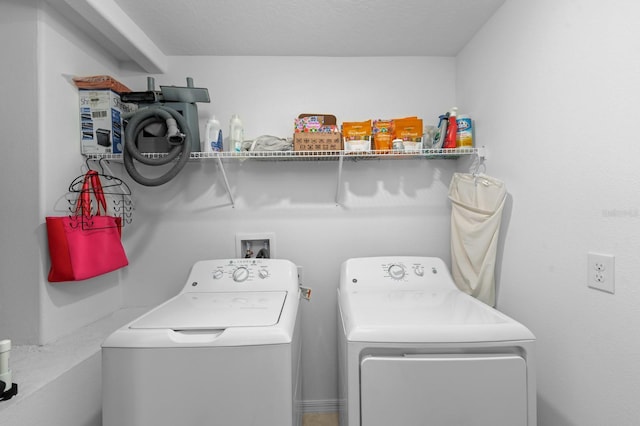 laundry room with washing machine and dryer and laundry area