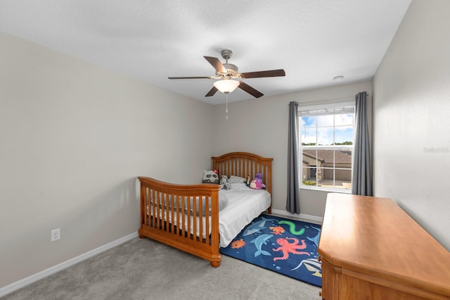 bedroom featuring ceiling fan, carpet floors, and baseboards