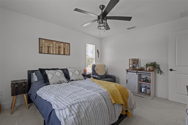 bedroom with a ceiling fan, light carpet, visible vents, and baseboards
