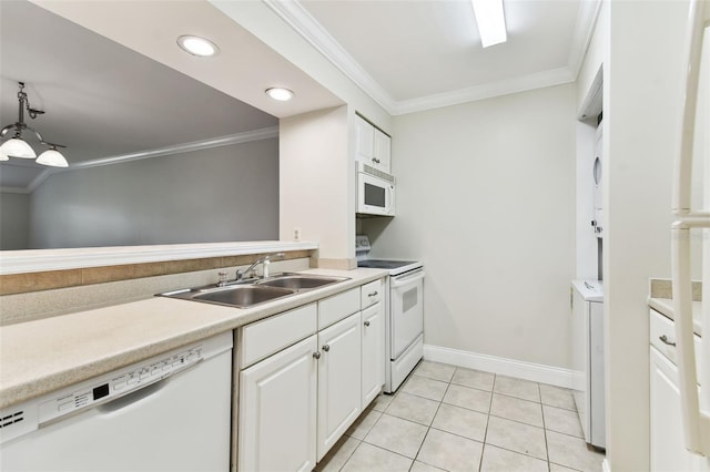 kitchen featuring white appliances, a sink, crown molding, white cabinetry, and light tile patterned floors