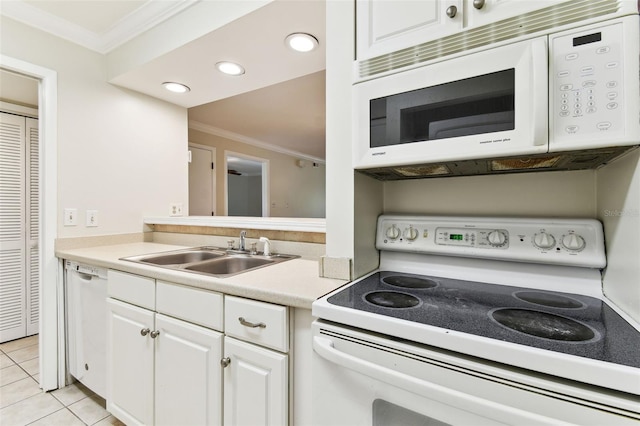 kitchen featuring white appliances, a sink, ornamental molding, white cabinets, and light countertops
