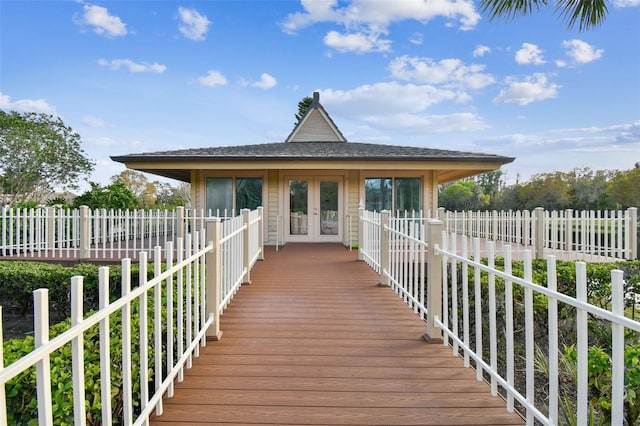 deck with french doors and fence