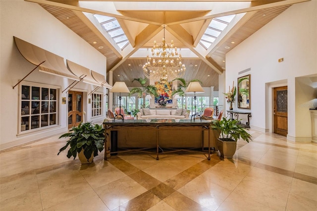 welcome area with a skylight, high vaulted ceiling, a chandelier, beam ceiling, and recessed lighting