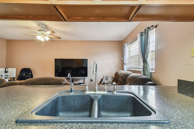 8531 Woodcrest Dr, Port Richey, FL 34668 - kitchen with a sink, open floor plan, a textured ceiling, and ceiling fan