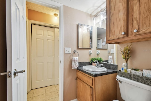 8531 Woodcrest Dr, Port Richey, FL 34668 - bathroom with tile patterned flooring, toilet, and vanity