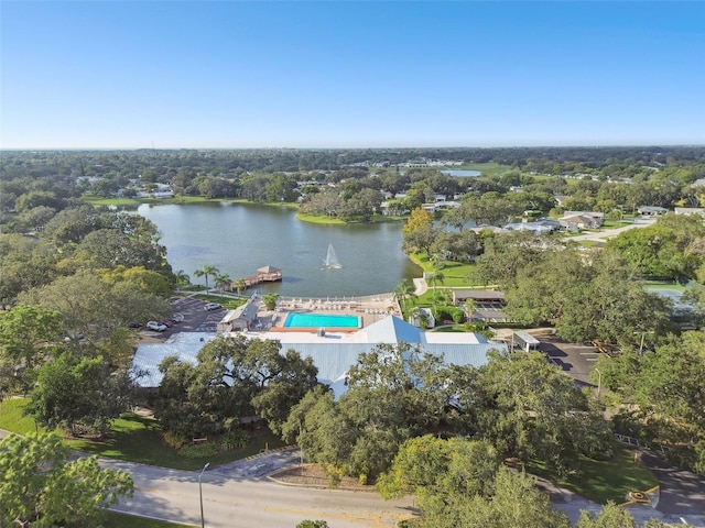 8531 Woodcrest Dr, Port Richey, FL 34668 - aerial overview of property's location with a nearby body of water, a pool area, and a tree filled landscape