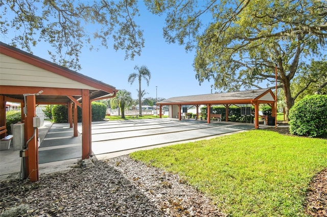 8531 Woodcrest Dr, Port Richey, FL 34668 - view of community with shuffleboard and a yard