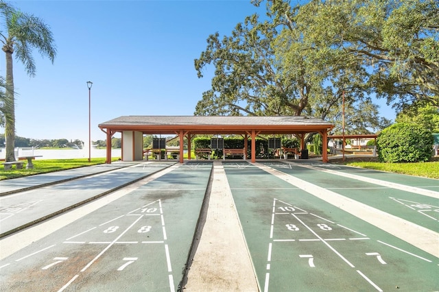 8531 Woodcrest Dr, Port Richey, FL 34668 - view of home's community featuring shuffleboard and a water view