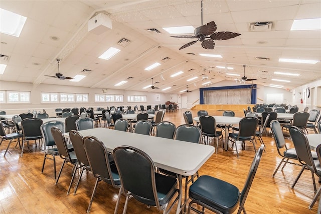 8531 Woodcrest Dr, Port Richey, FL 34668 - dining space with a ceiling fan, wood finished floors, and lofted ceiling