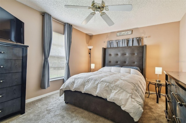 8531 Woodcrest Dr, Port Richey, FL 34668 - carpeted bedroom with a textured ceiling, baseboards, and ceiling fan