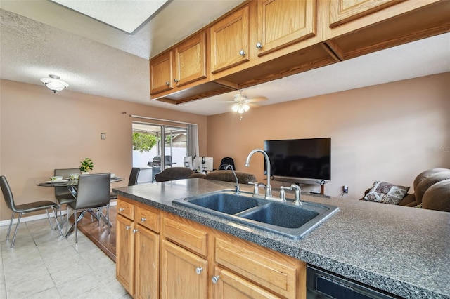 8531 Woodcrest Dr, Port Richey, FL 34668 - kitchen with a sink, black dishwasher, open floor plan, dark countertops, and a textured ceiling