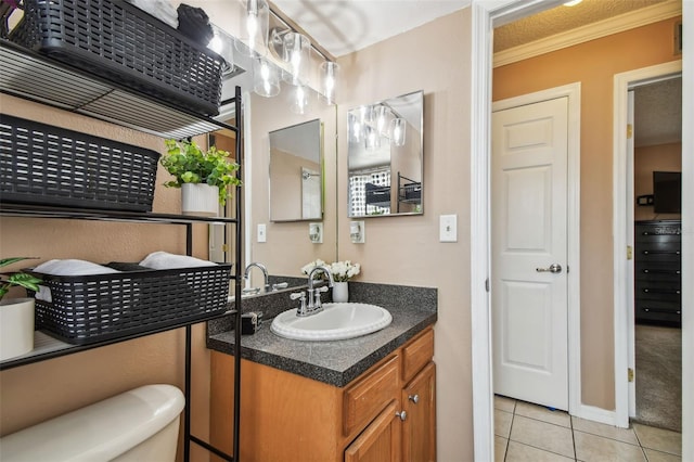 8531 Woodcrest Dr, Port Richey, FL 34668 - half bathroom with tile patterned flooring, crown molding, toilet, and vanity