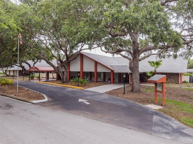8531 Woodcrest Dr, Port Richey, FL 34668 - view of building exterior featuring uncovered parking