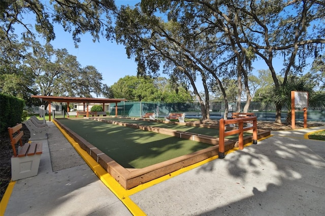 8531 Woodcrest Dr, Port Richey, FL 34668 - surrounding community featuring a bocce ball area and fence