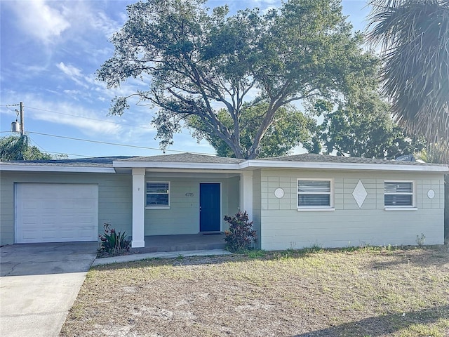4715 W Chapin Ave, Tampa, FL 33611 - ranch-style home with a garage, driveway, and covered porch