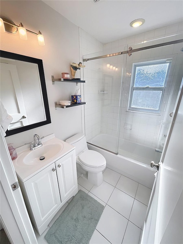 4715 W Chapin Ave, Tampa, FL 33611 - bathroom featuring tile patterned flooring, vanity, toilet, and shower / bath combination with glass door