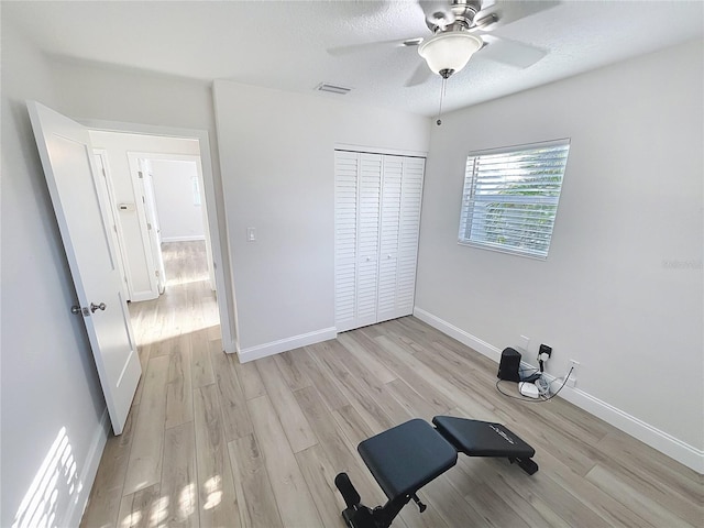 4715 W Chapin Ave, Tampa, FL 33611 - workout room with light wood-type flooring, baseboards, and a ceiling fan