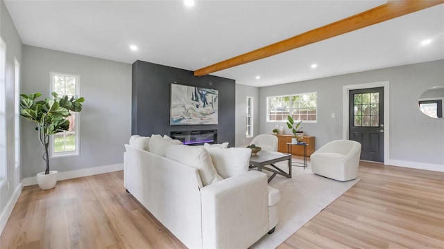 1715 N Alexander Rd, Tampa, FL 33603 - living area featuring recessed lighting, light wood finished floors, beam ceiling, and a healthy amount of sunlight