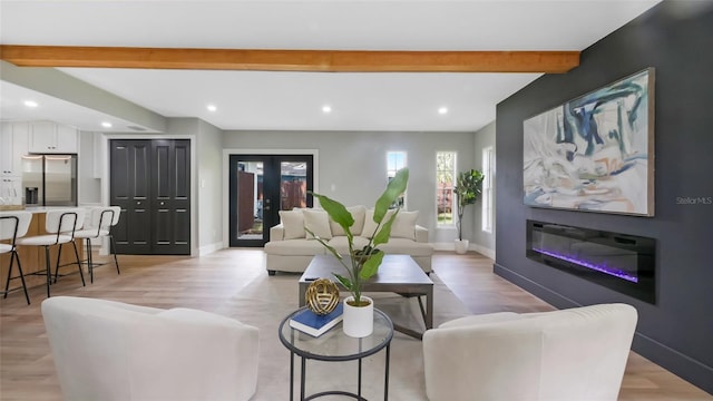 1715 N Alexander Rd, Tampa, FL 33603 - living area with recessed lighting, baseboards, beam ceiling, and light wood-type flooring