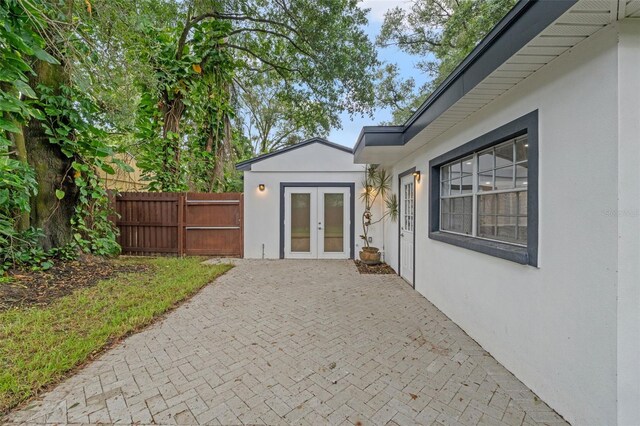 1715 N Alexander Rd, Tampa, FL 33603 - view of patio / terrace with french doors and fence