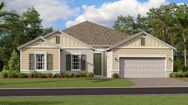 view of front of house with an attached garage, driveway, a front lawn, board and batten siding, and a shingled roof