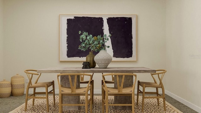 carpeted dining space featuring baseboards