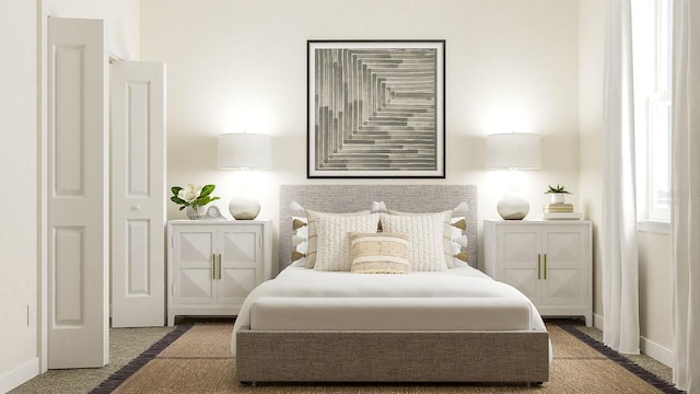 bedroom with carpet and baseboards