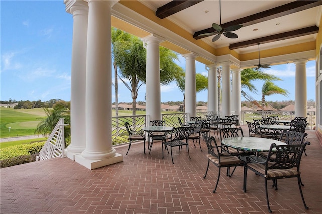 view of patio / terrace featuring golf course view and ceiling fan