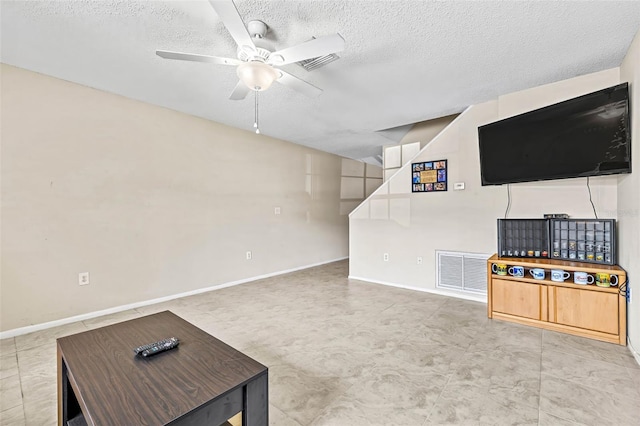 732 Kensington Lake Cir, Brandon, FL 33511 - unfurnished living room featuring ceiling fan, a textured ceiling, and baseboards