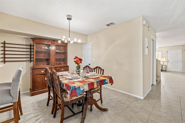 732 Kensington Lake Cir, Brandon, FL 33511 - dining space featuring a chandelier, baseboards, and light tile patterned floors