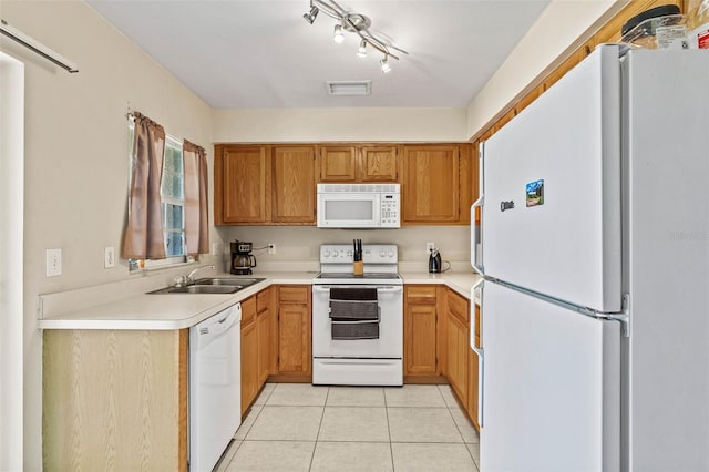 732 Kensington Lake Cir, Brandon, FL 33511 - kitchen with white appliances, a sink, light tile patterned floors, and light countertops