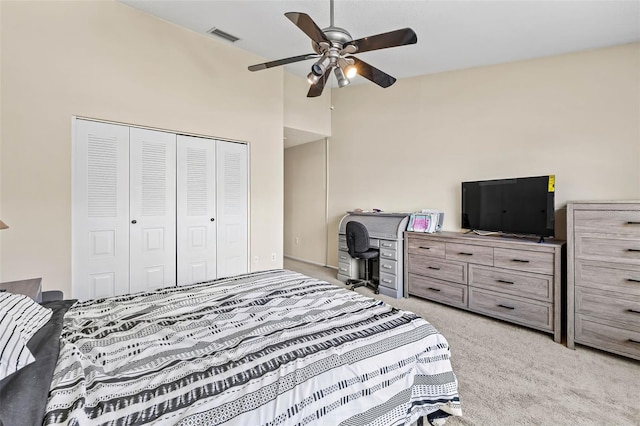 732 Kensington Lake Cir, Brandon, FL 33511 - bedroom with light colored carpet, a closet, and ceiling fan