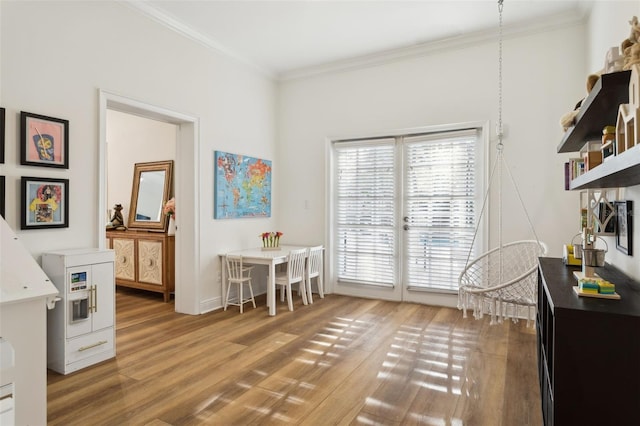 office area with wood finished floors and crown molding