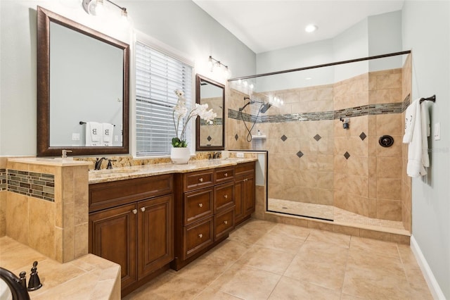 full bath with walk in shower, double vanity, and tile patterned floors