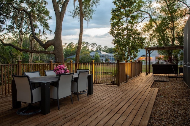 wooden terrace with outdoor dining space