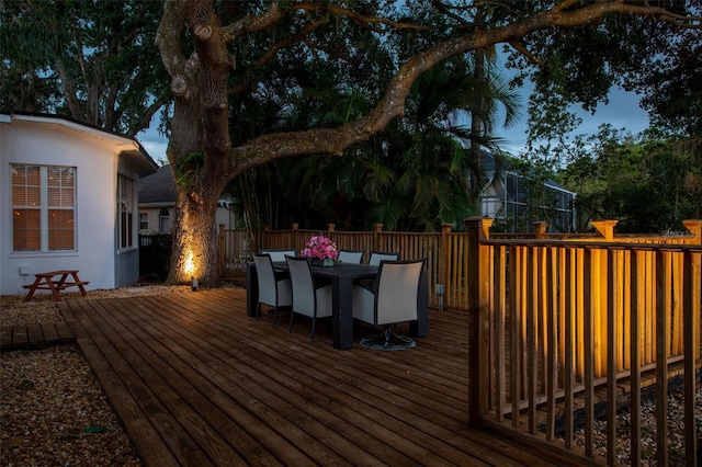 wooden deck featuring outdoor dining area
