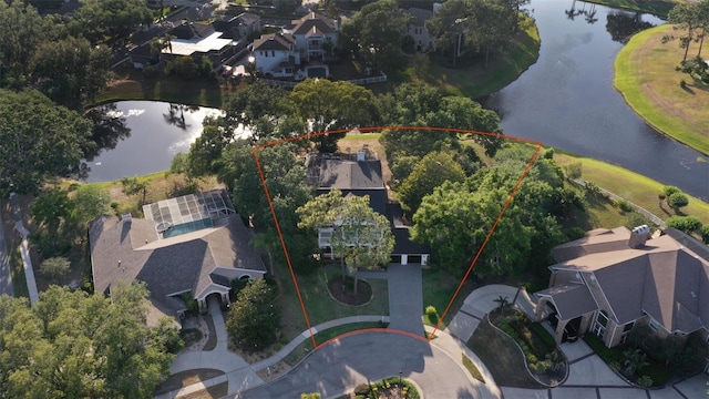 aerial perspective of suburban area featuring a large body of water and property parcel outlined