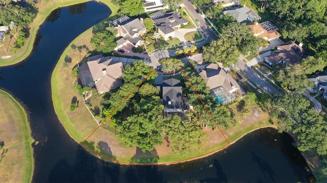 aerial perspective of suburban area with a nearby body of water and property parcel outlined