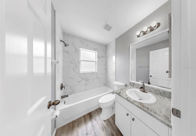 2675 Cherokee St, North Port, FL 34286 - full bath with toilet, vanity,  shower combination, and wood finished floors