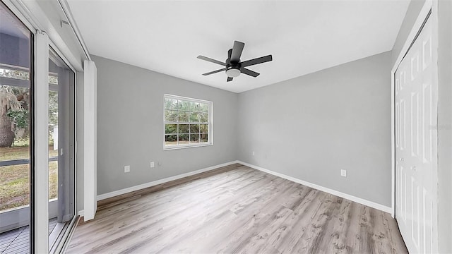 2675 Cherokee St, North Port, FL 34286 - unfurnished bedroom featuring light wood-style flooring, baseboards, a closet, and ceiling fan