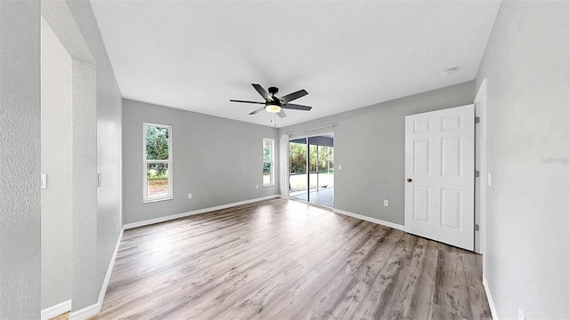 2675 Cherokee St, North Port, FL 34286 - unfurnished room featuring plenty of natural light and wood finished floors