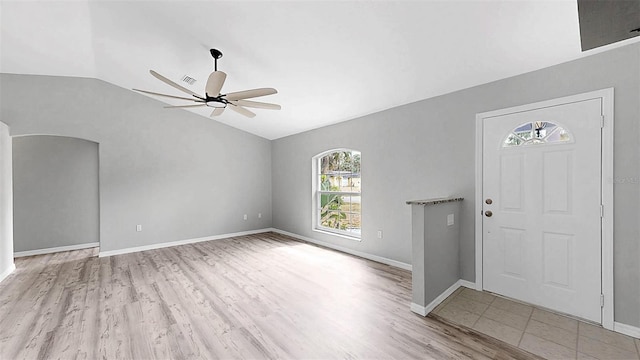 2675 Cherokee St, North Port, FL 34286 - foyer featuring vaulted ceiling, a ceiling fan, wood finished floors, and baseboards