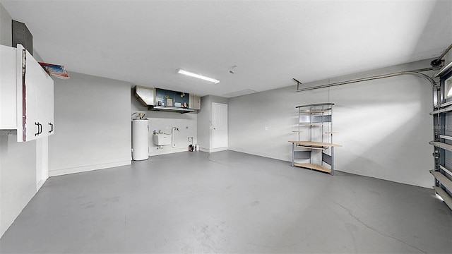 2675 Cherokee St, North Port, FL 34286 - garage with water heater and baseboards