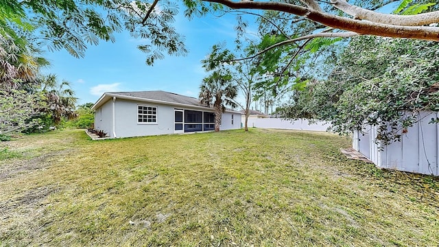 2675 Cherokee St, North Port, FL 34286 - rear view of property featuring a sunroom and stucco siding
