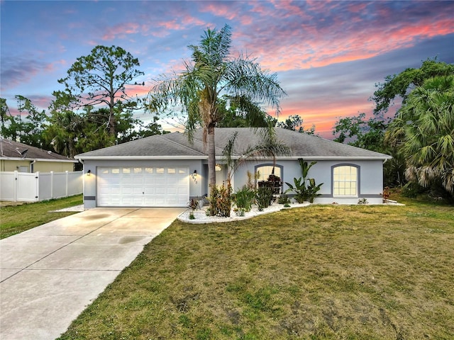 2675 Cherokee St, North Port, FL 34286 - ranch-style home with stucco siding, an attached garage, and concrete driveway