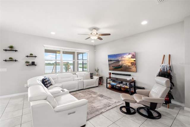living area with ceiling fan, light tile patterned flooring, baseboards, and recessed lighting