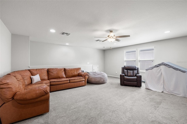 living room with carpet floors, visible vents, a ceiling fan, and recessed lighting