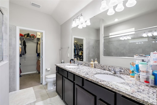 full bath with a sink, toilet, visible vents, and tile patterned floors