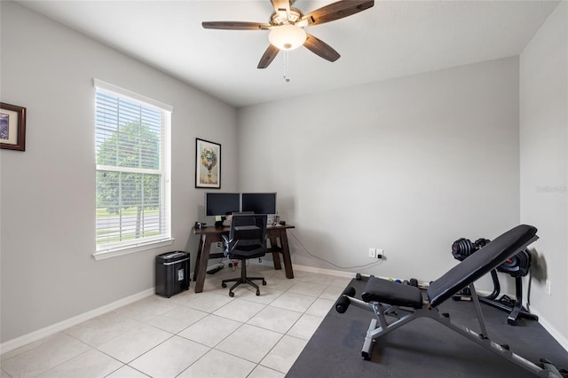 office area with ceiling fan, baseboards, and a healthy amount of sunlight