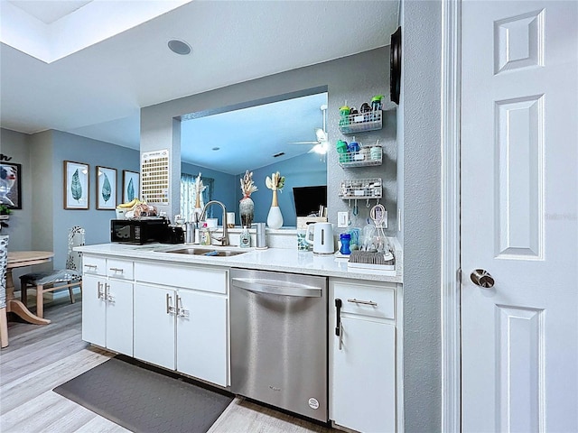 bar with light wood-style flooring, a sink, and stainless steel dishwasher